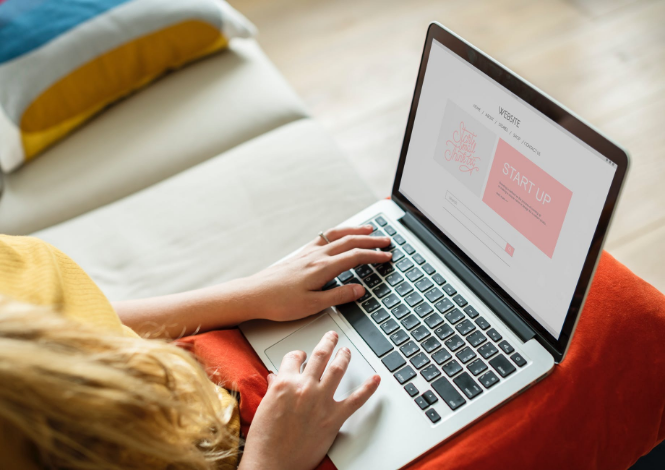 a person using a laptop on the couch